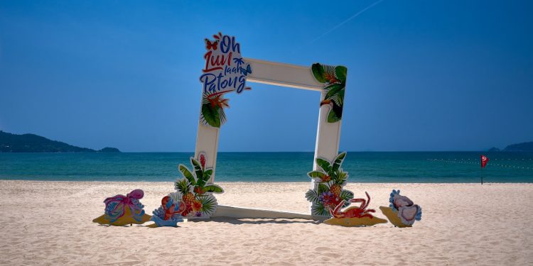 a picture frame sitting on top of a sandy beach