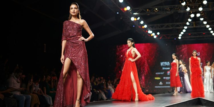 woman wearing maroon one-shoulder slit-side dress
