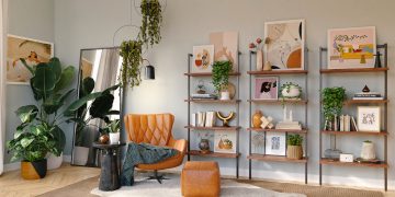 brown and black armchair beside white wooden shelf